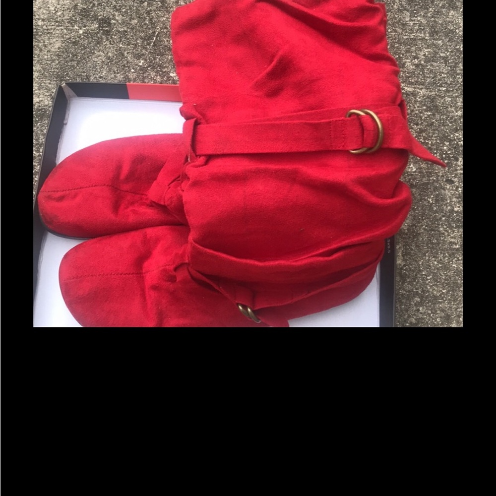 Slightly worn red winter boots